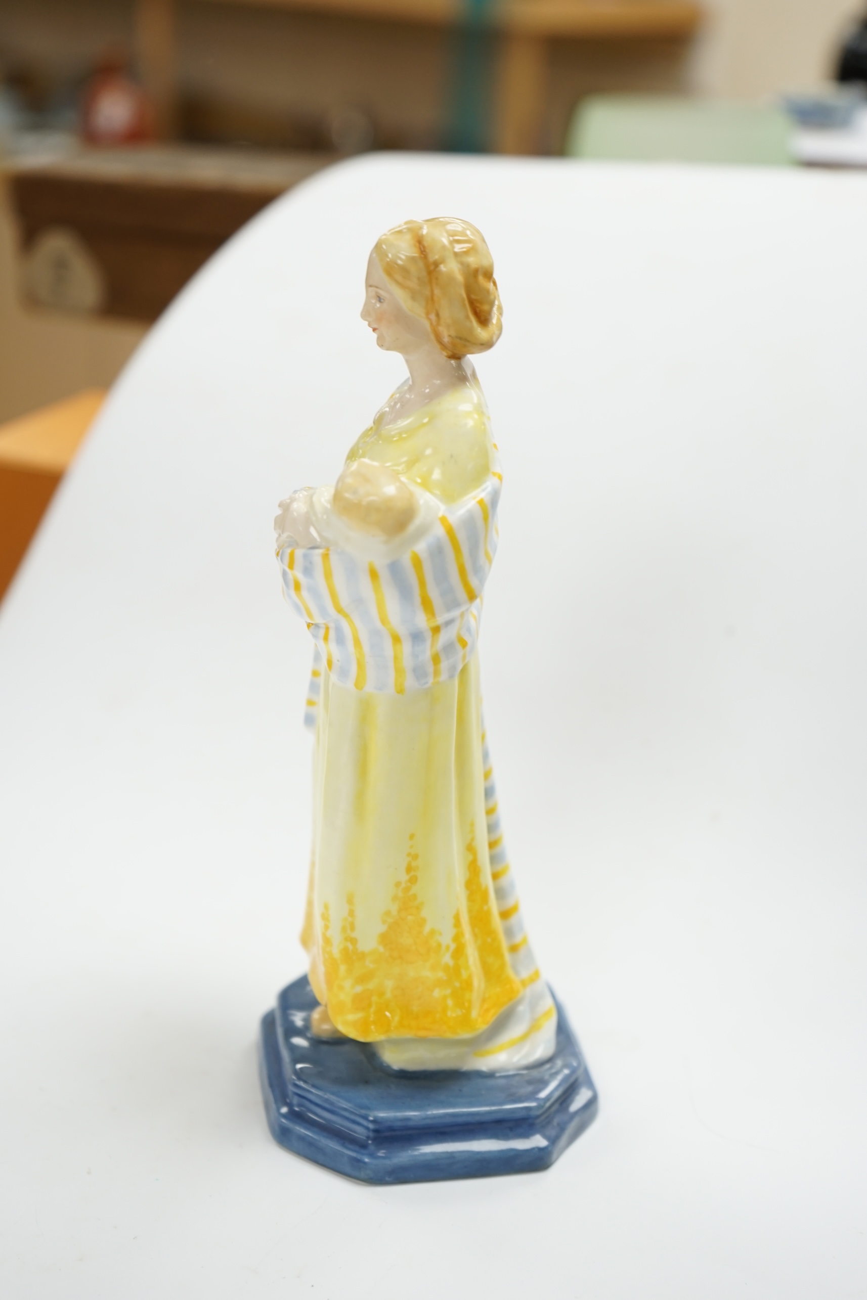 A Royal Worcester figure, 'A Flower girl', modelled by Phoebe Stabler, 20.5cm high. Condition - good